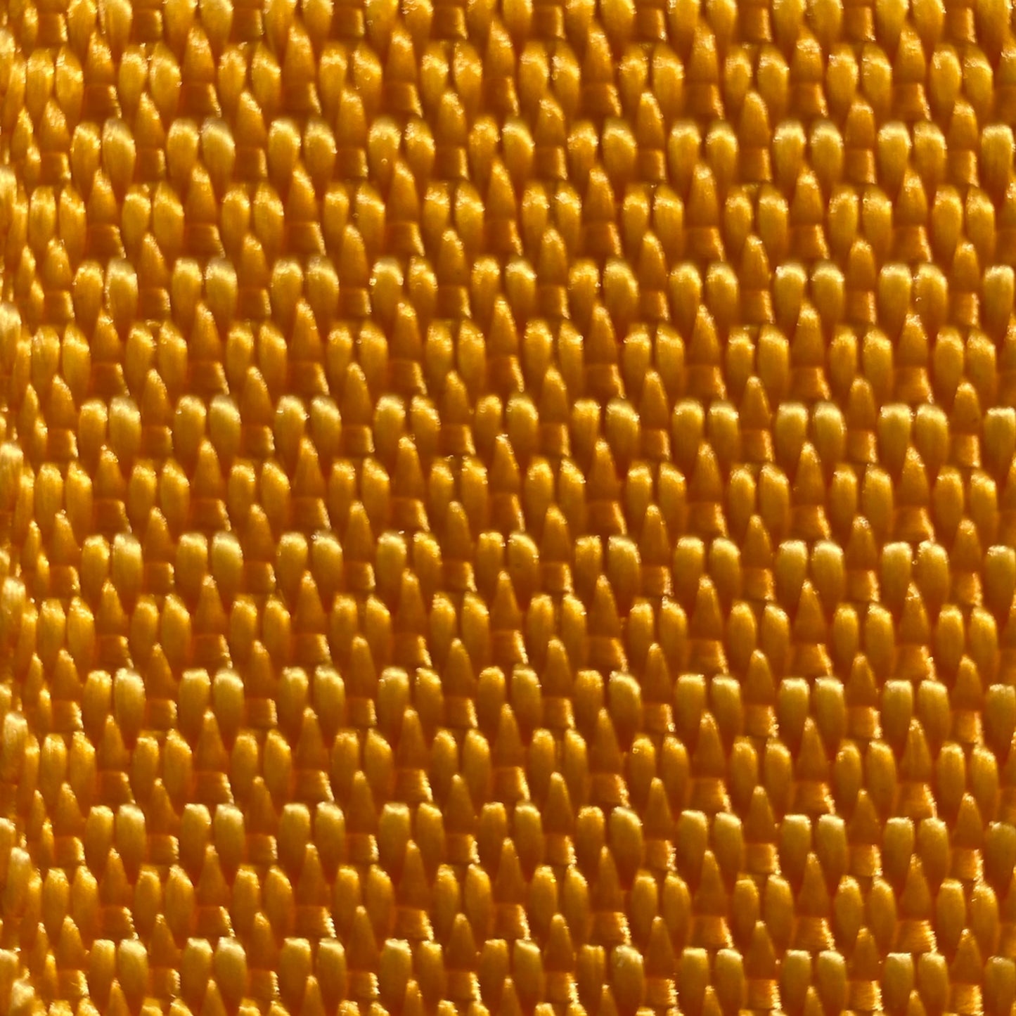 close up shot of orange diamond weave webbing